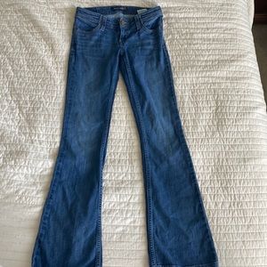 low rise flare bottom levi jeans dark wash stitching on the pockets